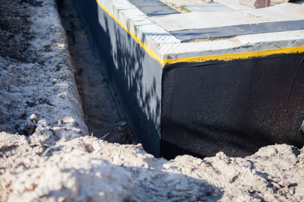 Professional Emergency Waterproofing technician working in Owings Mills, MD